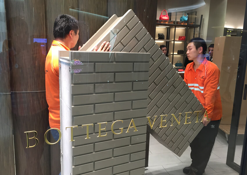 Avenir Logistics team performing store installation at Bottega Veneta in Singapore.