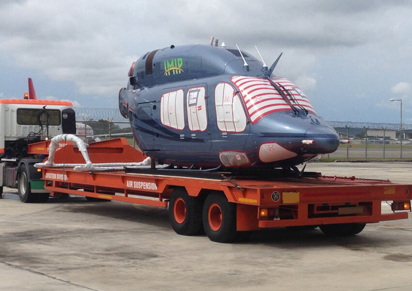 Helicopter being transported on an air suspension trailer by Avenir Logistics Solutions in Singapore.